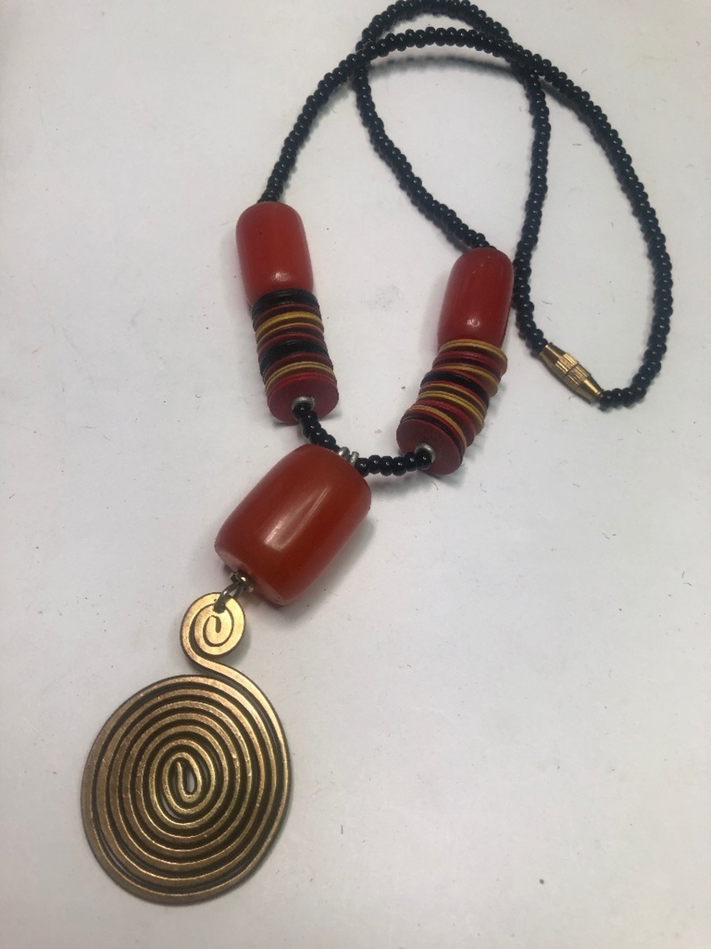 Vintage necklace faux Bakelite bead brass pendant
